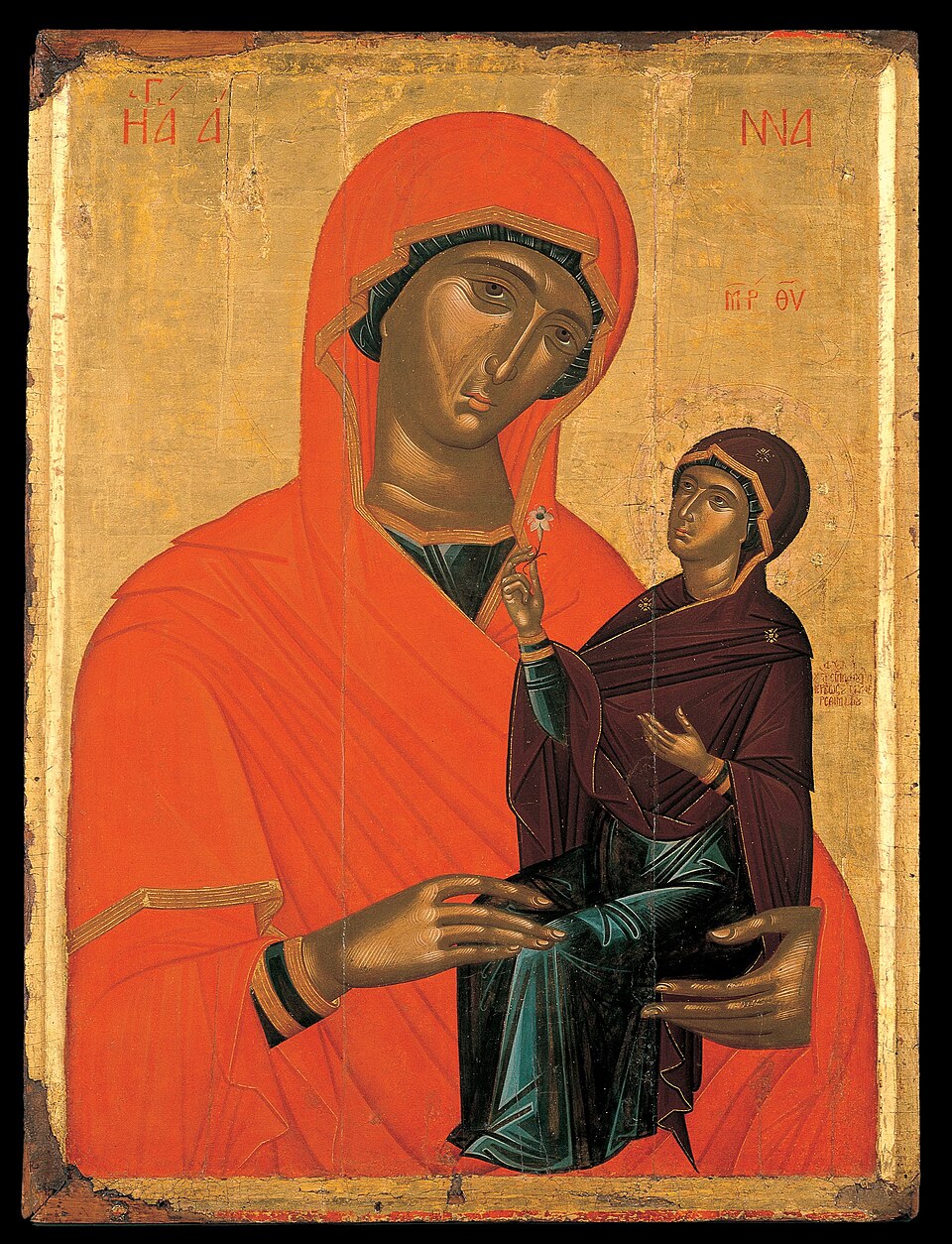 Icono bizantino de santa Ana con manto rojo sosteniendo en brazos a la Virgen María niña sobre fondo dorado
