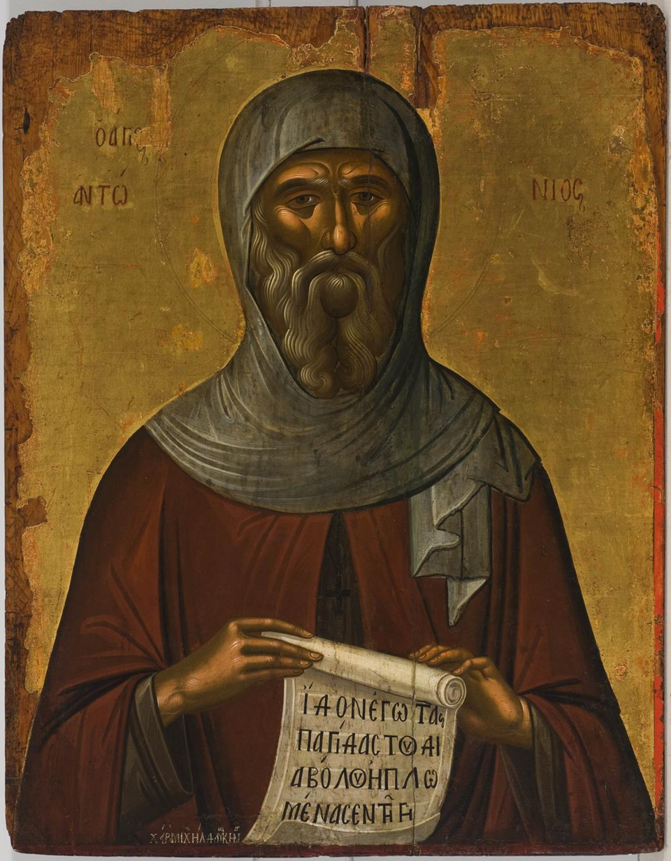 Icono de san Antonio de Egipto con capucha gris, larga barba y un rollo escrito entre las manos