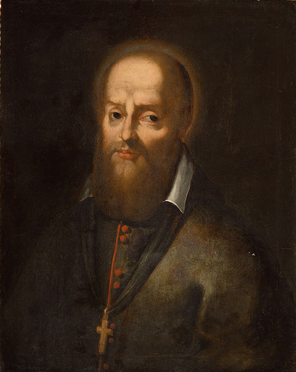 Retrato pintado de san Francisco de Sales, con barba castaña, aureola tenue y cruz pectoral sobre fondo oscuro