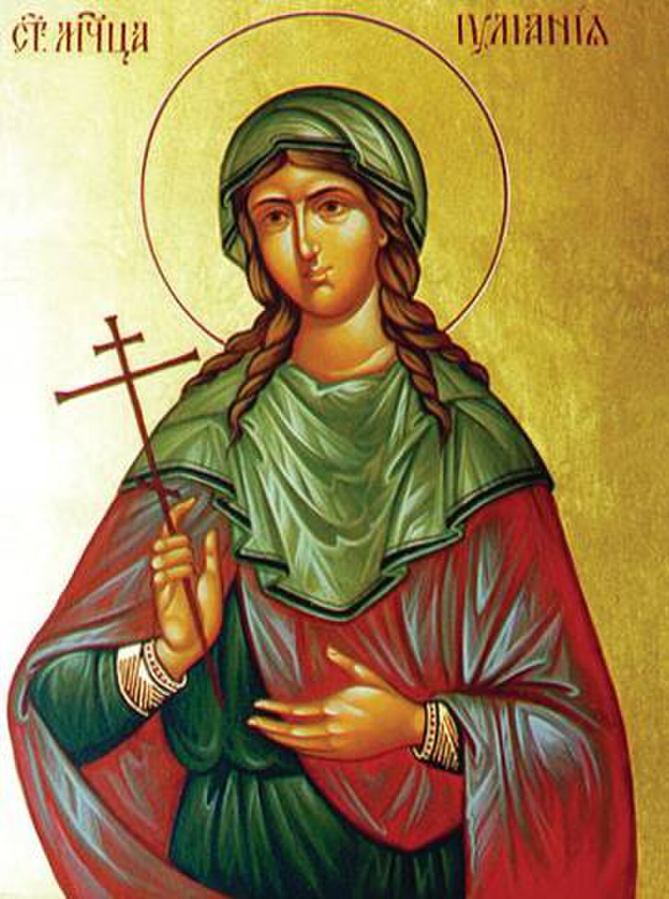 Icono de santa Juliana con velo verde, manto rojo y aureola, sosteniendo una cruz en la mano