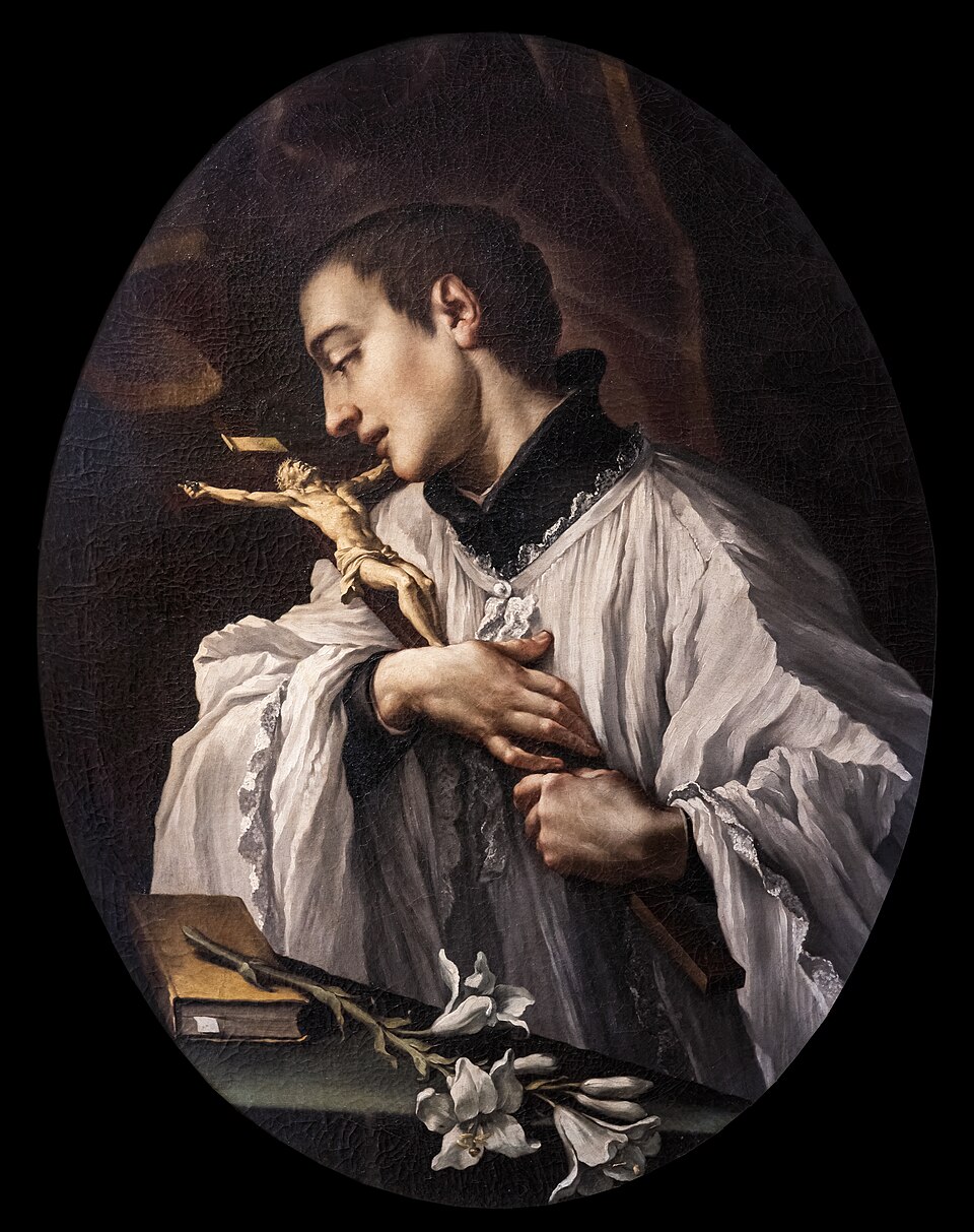 Pintura ovalada de san Luis Gonzaga con sobrepelliz, abrazando un crucifijo junto a un libro y lirios blancos
