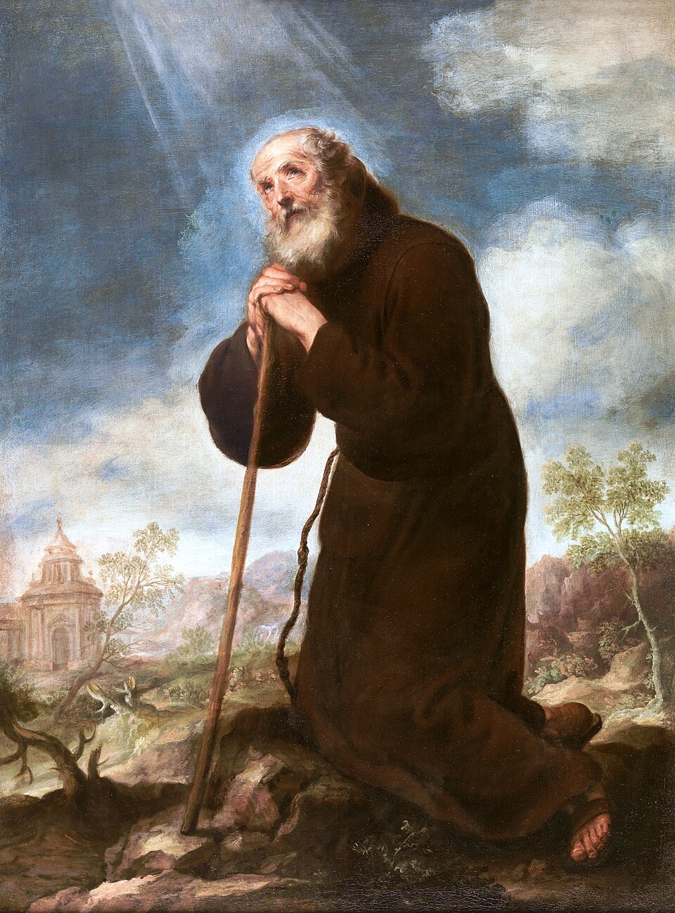 Pintura de san Francisco de Paula, anciano de barba blanca con hábito marrón, arrodillado y apoyado en un bastón