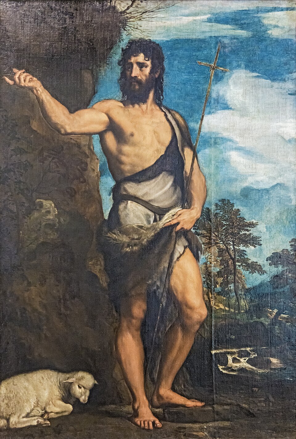 Pintura de san Juan Bautista con piel de camello y cruz de caña, señalando, con un cordero a sus pies