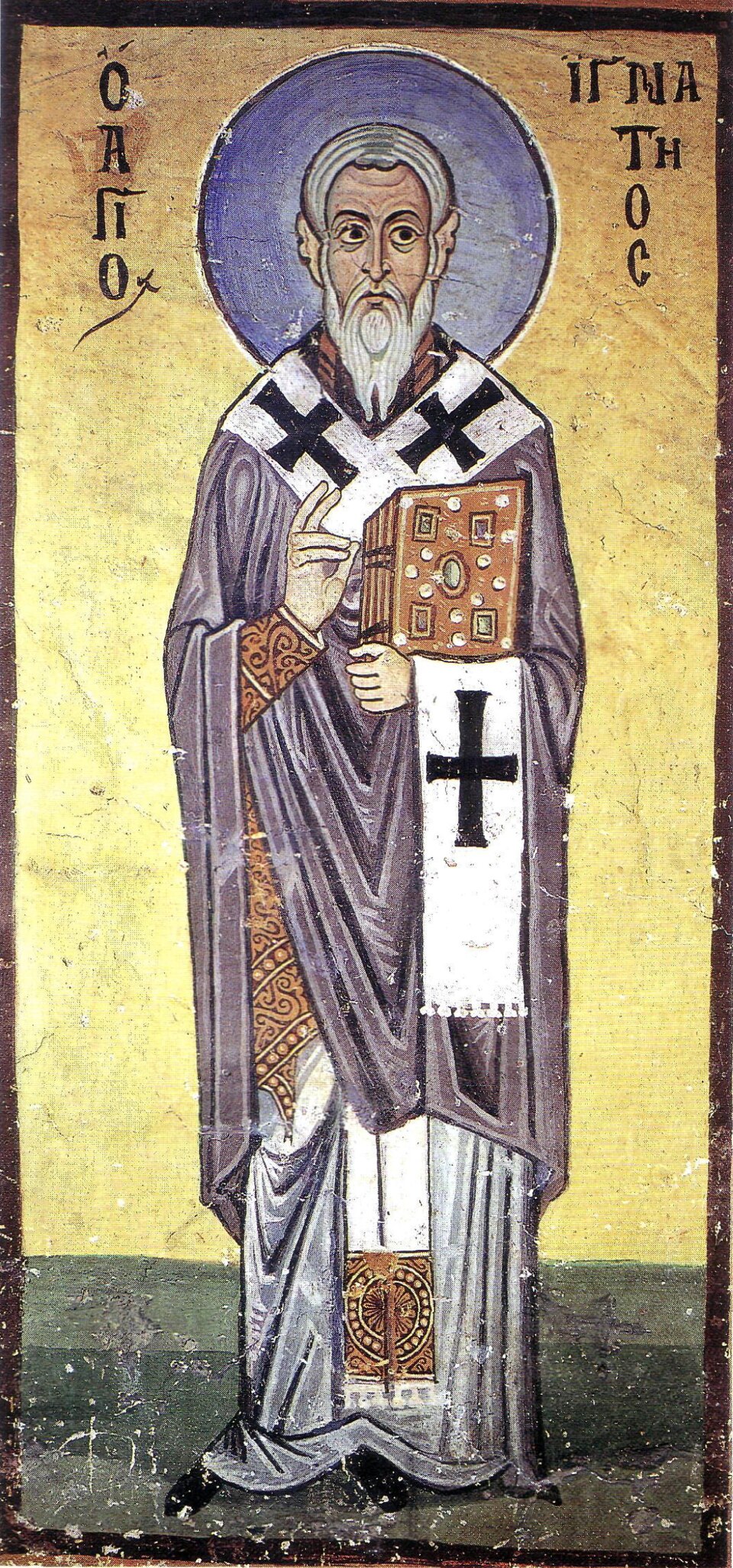 Icono bizantino de san Ignacio de Antioquía de cuerpo entero, con barba blanca, aureola azul y evangeliario